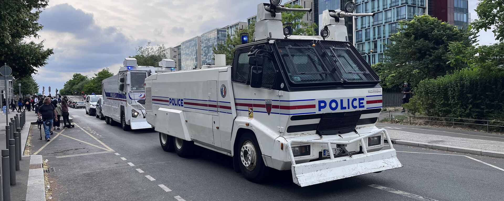 Police anti-riot vehicles are seen on a street during protests after the death of Nahel, a 17-year-old teenager killed by a French police officer during a traffic stop, in Nanterre, Paris suburb, France. - Sputnik International, 1920, 01.07.2023