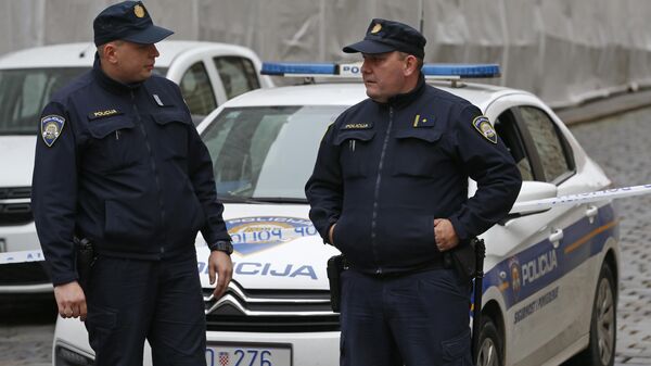 Police officers block the way to the Croatian parliament building near the site of shooting in Zagreb, Croatia, Monday Oct. 12, 2020.  - Sputnik International
