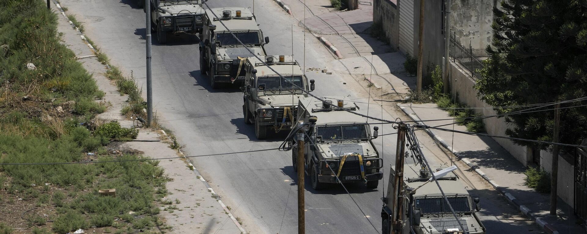 A convoy of army vehicles is seen during an Israeli military raid on the militant stronghold of the Jenin refugee camp in the occupied West Bank, Monday, July 3, 2023. Israeli drones struck targets and deployed hundreds of troops in the area in the largest operation in the area in more than a year of fighting. Palestinian health officials said at least eight Palestinians were killed. - Sputnik International, 1920, 04.07.2023