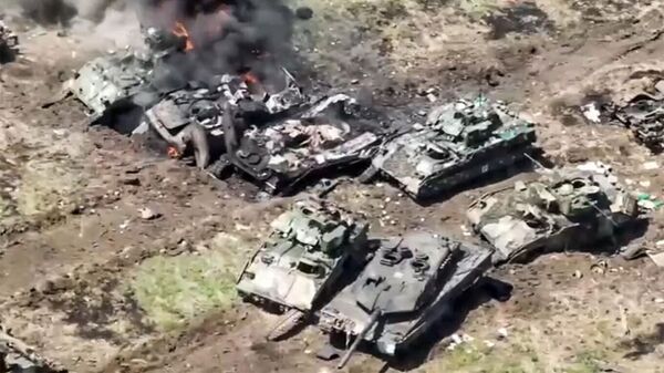Leopard 2 and Bradley pictured among destroyed and damaged Ukrainian vehicles. Screenshot of Russian Defense Ministry video. - Sputnik International