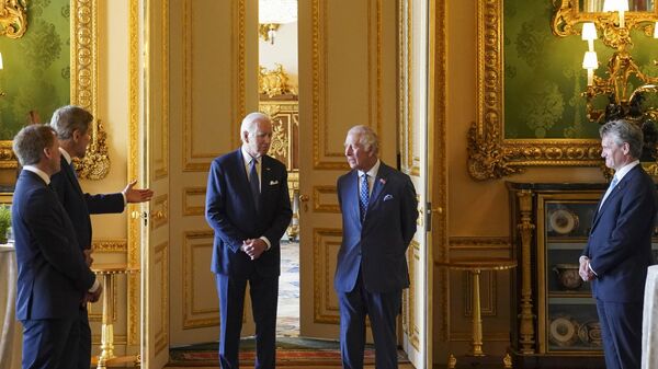 US Special Presidential Envoy for Climate John Kerry, second left, speaks to US President Joe Biden, centre left and Britain's King Charles III during a climate engagement with philanthropists and investors at Windsor Castle, in Windsor, England, Monday, July 10, 2023. - Sputnik International