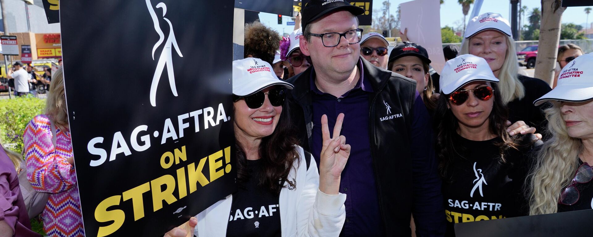 SAG-AFTRA president Fran Drescher from left, Duncan Crabtree-Ireland, SAG-AFTRA national executive director and chief negotiator, and actor Frances Fisher, at far right, take part in a rally by striking writers and actors outside Netflix studio in Los Angeles on Friday, July 14, 2023. This marks the first day actors formally joined the picket lines, more than two months after screenwriters began striking in their bid to get better pay and working conditions.  - Sputnik International, 1920, 15.07.2023