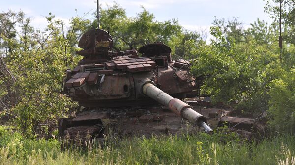 A destroyed tank of the Ukrainian Armed Forces in the village of Troitskoye, Lugansk People's Republic. File photo - Sputnik International