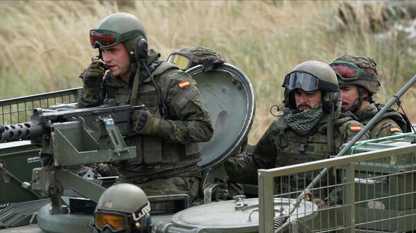 Spain's soldiers ride their military vehicle during the NATO military exercises ''Namejs 2021.'' - Sputnik International