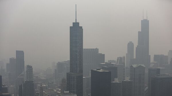 Chicago's skyline is seen from the 360 Chicago Observation Deck of the John Hancock Building with heavy smoke from the Canadian wildfires blanketing the city, on June 27, 2023, in Chicago, Illinois. Chicago Mayor Brandon Johnson said in a statement, “The City of Chicago is carefully monitoring and taking precautions as the US Environmental Protection Agency (EPA) has categorized our Air Quality Index as unhealthy due to Canadian wildfire smoke present in the Chicago region. We recommend children, teens, seniors, people with heart or lung disease, and individuals who are pregnant avoid strenuous activities and limit their time outdoors. - Sputnik International