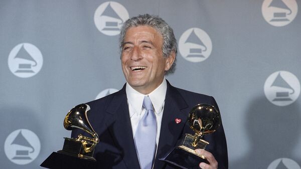 Veteran singer Tony Bennett displays his two Grammy's backstage at the Shrine Auditorium in Los Angeles Wednesday, March 1, 1995. Bennett, the eminent and timeless stylist whose devotion to classic American songs and knack for creating new standards such as I Left My Heart In San Francisco graced a decadeslong career that brought him admirers from Frank Sinatra to Lady Gaga, died Friday, July 21, 2023. He was 96.  - Sputnik International