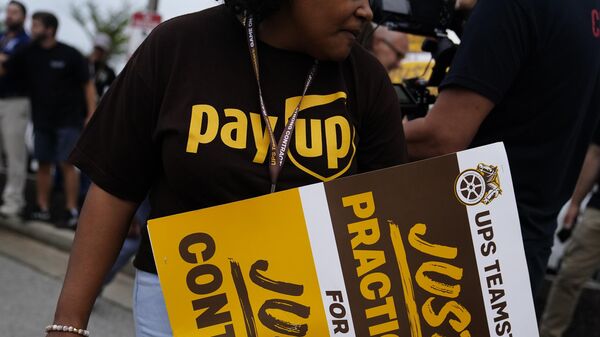 UPS teamsters and workers hold a rally Friday, July 21, 2023, in Atlanta, as a national strike deadline nears. The Teamsters said Friday that they will resume contract negotiations with UPS, marking an end to a stalemate that began two weeks ago when both sides walked away from talks while blaming each other. - Sputnik International
