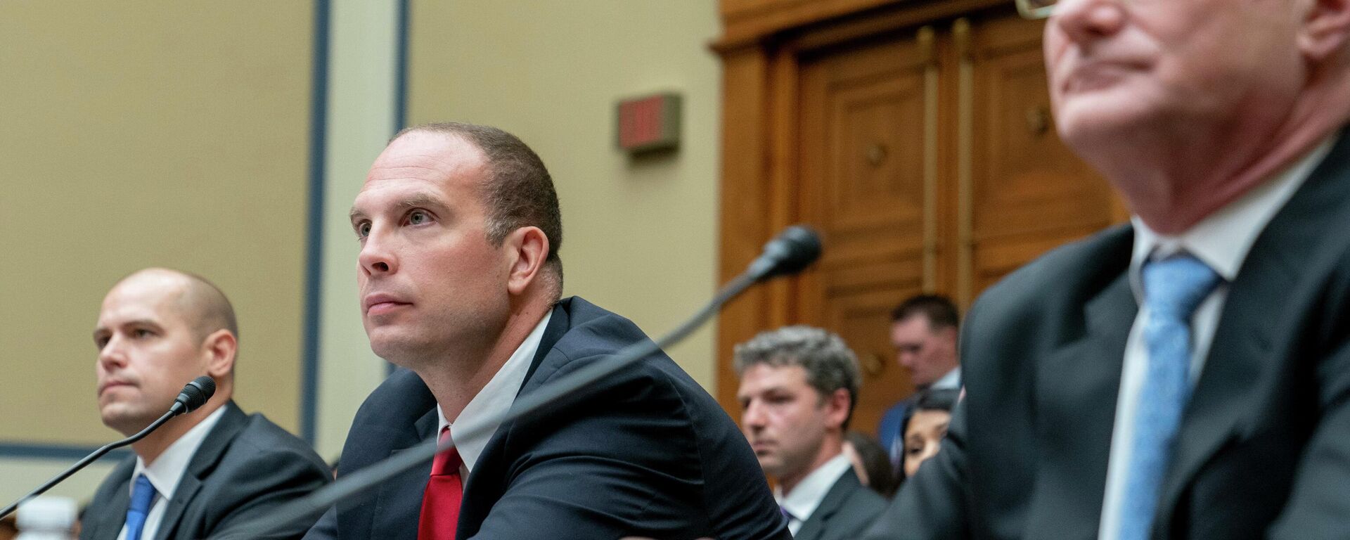 Ryan Graves, Americans for Safe Aerospace Executive Director, from left, U.S. Air Force (Ret.) Maj. David Grusch, and U.S. Navy (Ret.) Cmdr. David Fravor, testify before a House Oversight and Accountability subcommittee hearing on UFOs, Wednesday, July 26, 2023, on Capitol Hill in  Washington. (AP Photo/Nathan Howard) - Sputnik International, 1920, 26.07.2023