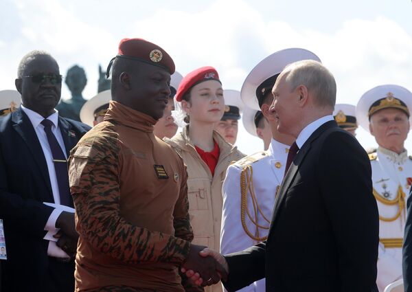 Russian President Vladimir Putin, the supreme commander-in-chief, and Burkina Faso&#x27;s Interim President Ibrahim Traore attend the parade in honor of Navy Day. - Sputnik International