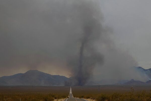 A rising vortex of ash from the York Fire in the Mojave National Preserve on July 30, 2023, - Sputnik International