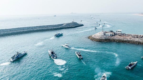 This photo, provided by Iran&#x27;s Revolutionary Guard Corps (IRGC) official website, shows Iranian Revolutionary Guard naval vessels taking part in a military drill near the island of Abu Musa, off the coast of the southern Iranian city of Bandar Lengeh. - Sputnik International