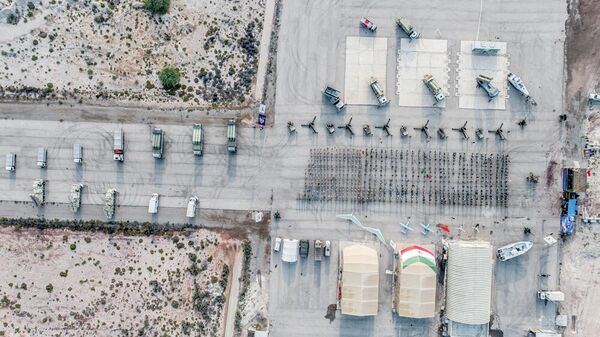 This photo provided by Iran&#x27;s Revolutionary Guard Corps (IRGC) official website shows Iranian Revolutionary Guard soldiers taking part in a military drill near the island of Abu Musa, off the coast of the southern Iranian city of Bandar Lengeh. - Sputnik International