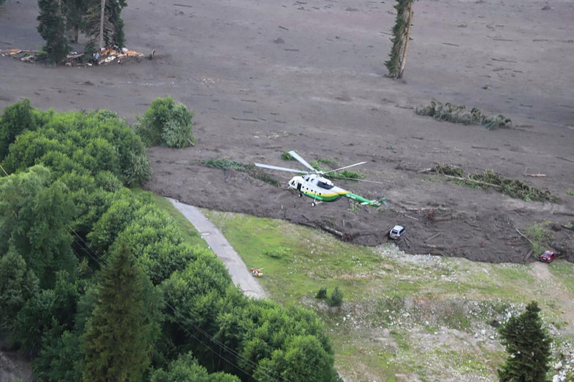 In this image provided by Ministry of Internal Affairs of Georgia press service, a rescue helicopter flies over a landslide area near Shovi, about 140 kilometers (85 miles) northwest of the capital Tbilisi, Georgia, Friday, Aug. 4, 2023. At least seven people were killed and more than 30 are missing after a landslide hit a resort area in the mountains of the country of Georgia, officials and news reports said Friday.  - Sputnik International, 1920, 06.08.2023