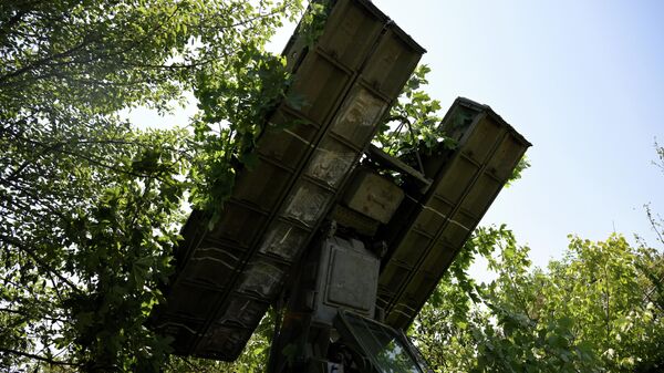 A view shows a 9K35 Strela-10 (Arrow) air defense system of the 2nd Russian Army Corps of the Southern Group of Forces at a position in the course of Russia's military operation in Ukraine - Sputnik International