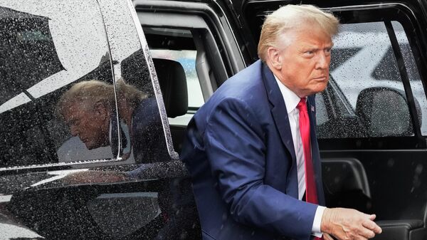 FILE - Former President Donald Trump arrives to board his plane at Ronald Reagan Washington National Airport, Thursday, Aug. 3, 2023, in Arlington, Va., after facing a judge on federal conspiracy charges that allege he conspired to subvert the 2020 election.  - Sputnik International