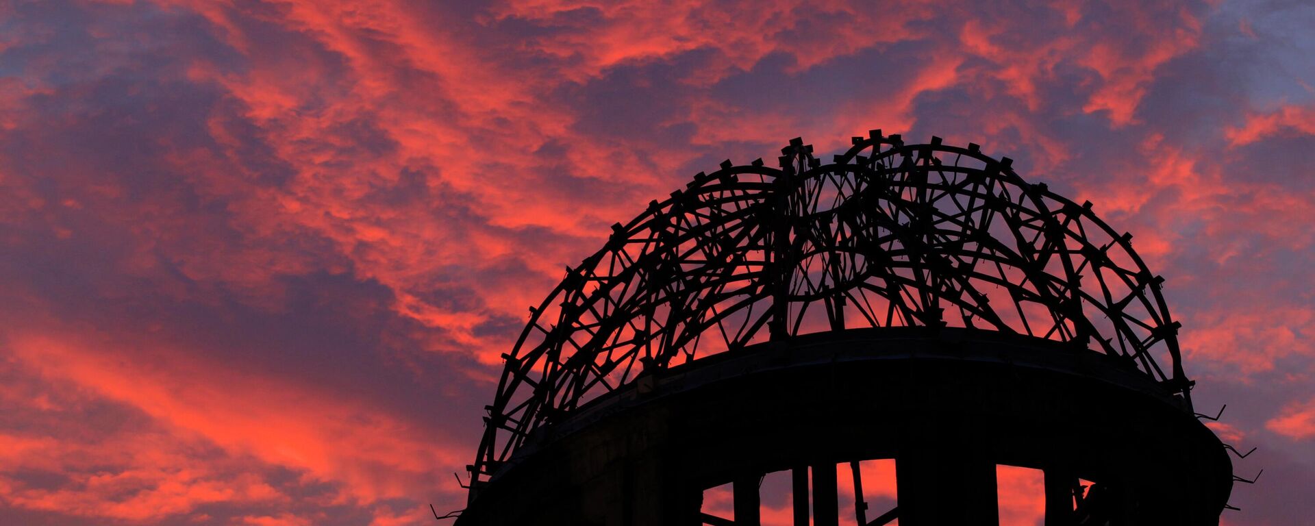 In this Aug. 5, 2013, file photo, the Atomic Bomb Dome is silhouetted at sunset in Hiroshima, western Japan.  - Sputnik International, 1920, 06.08.2025