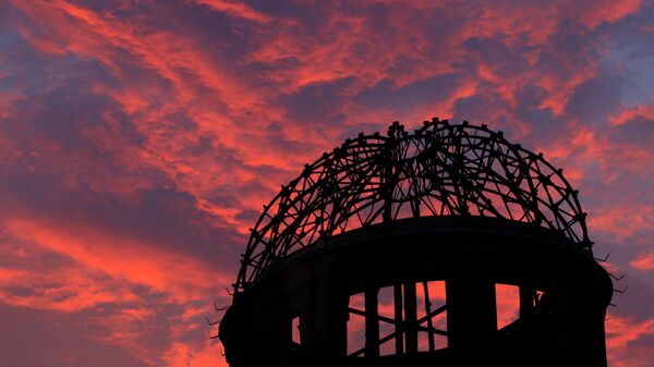 In this Aug. 5, 2013, file photo, the Atomic Bomb Dome is silhouetted at sunset in Hiroshima, western Japan.  - Sputnik International