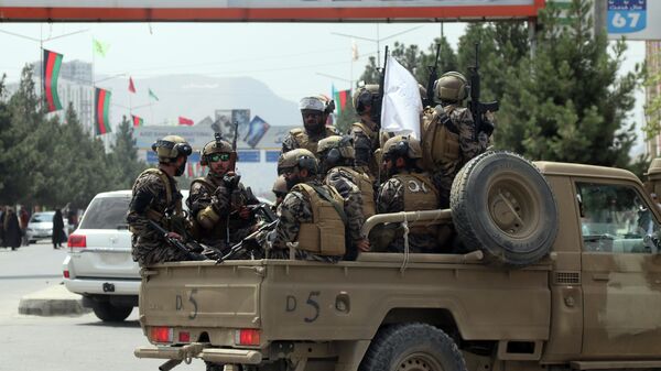 FILE - Taliban special force fighters arrive inside the Hamid Karzai International Airport after the U.S. military's withdrawal, in Kabul, Afghanistan, Aug. 31, 2021. A year after America's tumultuous and deadly withdrawal from Afghanistan, assessments of its impact are divided — and largely along partisan lines. - Sputnik International