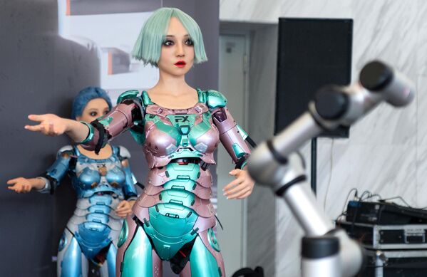 Robots at a booth at the World Robot Conference in Beijing. - Sputnik International