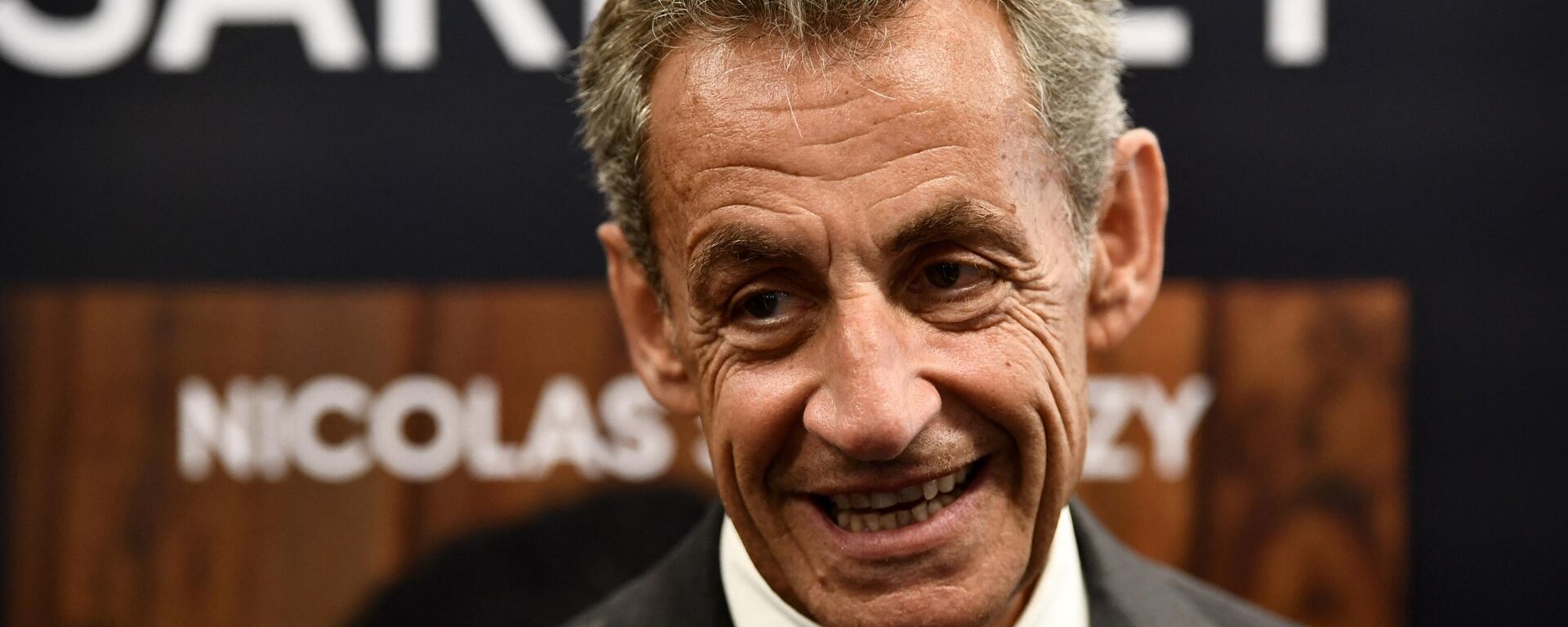 Former French President Nicolas Sarkozy reacts during a book signing session for his last book, in Arcachon, southwestern France, on August 25, 2023. Sarkozy will be tried in 2025 over allegations he took money from late Libyan dictator Moamer Kadhafi to fund one of his election campaigns, prosecutors said on August 25, 2023. - Sputnik International, 1920, 13.09.2023
