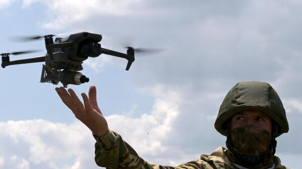 A Russian serviceman is seen using a drone in the special operation zone in Ukraine. File photo - Sputnik International