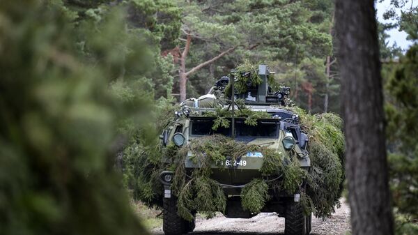 A Finnish armored terrain vehicle, Patria, is seen during a joint exercise between Finnish and Swedish troops at Tofta shooting field on the Swedish island Gotland on September 19, 2017 - Sputnik International