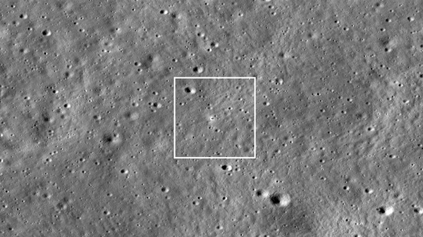 Chandrayaan-3 lander is in the center of the image, its dark shadow is visible against the bright halo surrounding the vehicle. The image is 1,738 meters wide; frame No. M1447750764LR. - Sputnik International