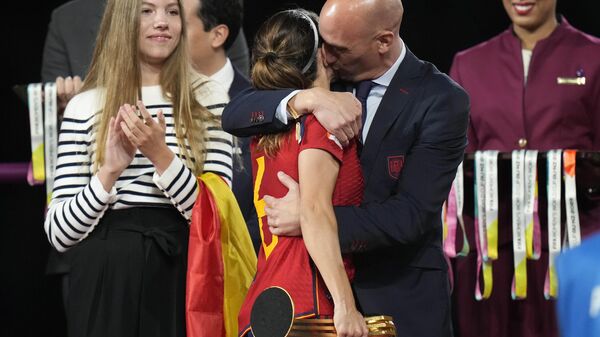 President of Spain's soccer federation, Luis Rubiales, right, hugs Spain's Aitana Bonmati on the podium following Spain's win in the final of Women's World Cup soccer against England at Stadium Australia in Sydney, Australia, Sunday, Aug. 20, 2023. Rubiales has resigned, Sunday, Sept. 10, 2023, from his post after a kiss scandal which tarnished Spain's victory at the Women's World Cup. - Sputnik International