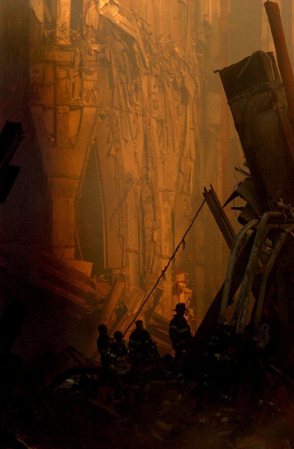 This photo released on 17 September 2001 by the US Navy Visual News service shows rescue workers conducting salvage operations descending deep into the rubble of the World Trade Center in New York.   - Sputnik International