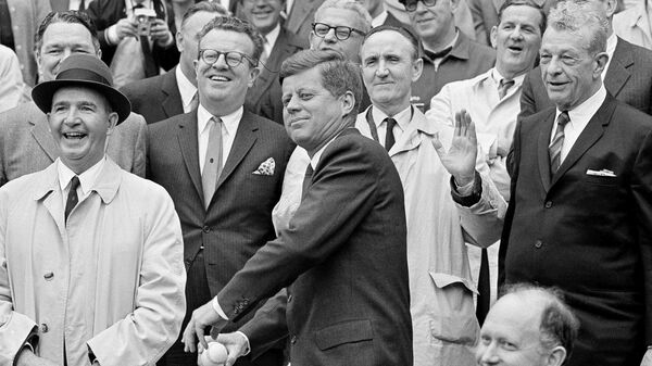 President John F. Kennedy winds up to throw out the first pitch to inaugurate the 1962 American League baseball season and DC Stadium in Washington in this April 9, 1962 file photo.  - Sputnik International
