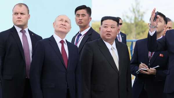 Russian President Vladimir Putin and North Korean State Council Chairman Kim Jong-un at the Vostochny Cosmodrome, September 13, 2023 - Sputnik International