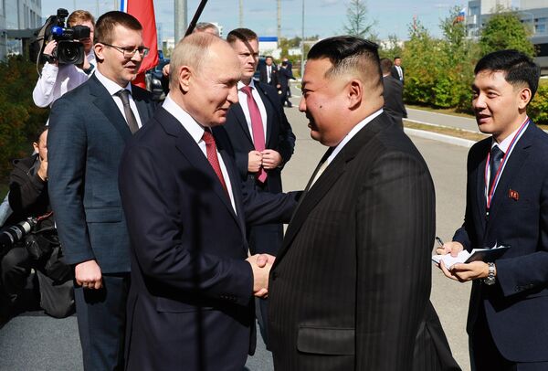 President Putin gives Chairman Kim a warm handshake as the two leaders meet the first time since 2019, September 13, 2023. - Sputnik International