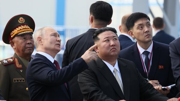 Russian President Vladimir Putin meets North Korean leader Kim Jong Un at the Vostochny Cosmodrome on September 13, 2023. - Sputnik International
