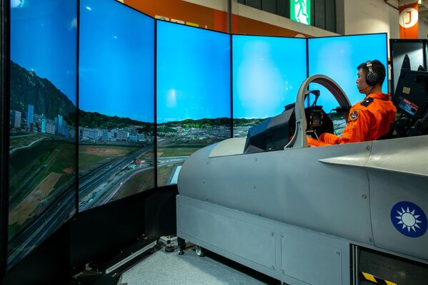 A Taiwanese Air Force pilot demonstrates an advanced jet trainer simulator at the TADTE, Taipei, Taiwan, September 14, 2023. - Sputnik International