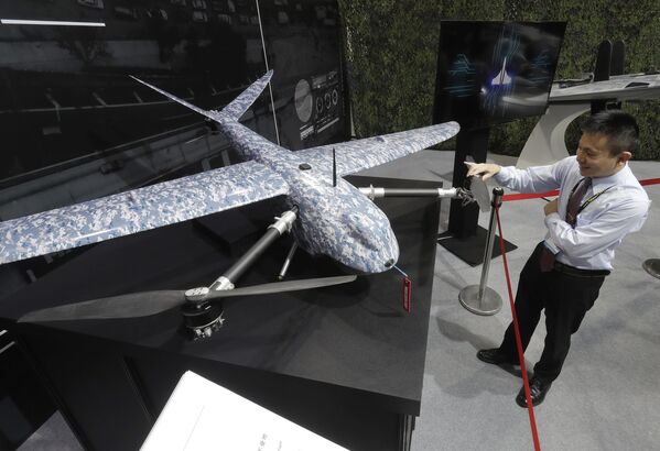 A guest touches the Cardinal III drone at the TADTE, Taipei, Taiwan, September 14, 2023. - Sputnik International