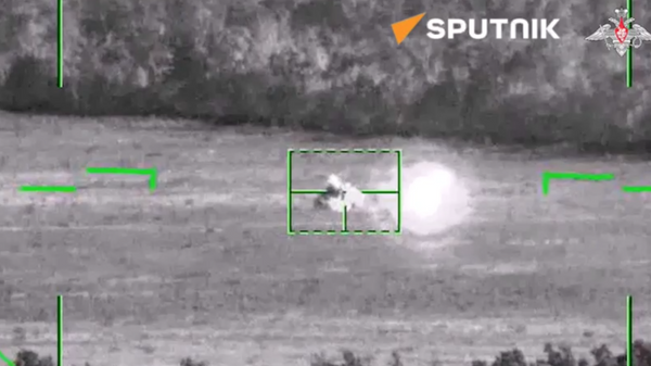 The crew of the Ka-52 reconnaissance and attack helicopter destroyed a Ukrainian Armed Forces tank with a guided missile strike - Sputnik International