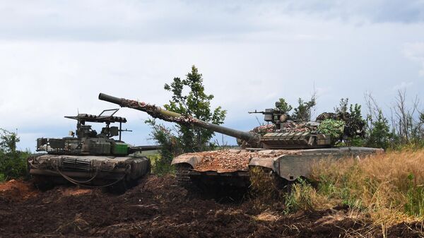 Customized T-80s from the 200-th Motorized Rifle Brigade of the Southern Group of Forces in the special operation zone near Soledar, Donetsk, June 2023. - Sputnik International