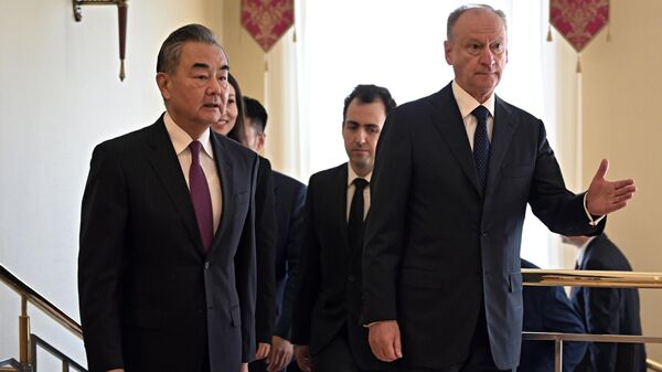 Secretary of the Russian Security Council Nikolai Patrushev, right, and Wang Yi, head of the Office of the Foreign Affairs Commission of the Central Committee of the Communist Party of China  - Sputnik International