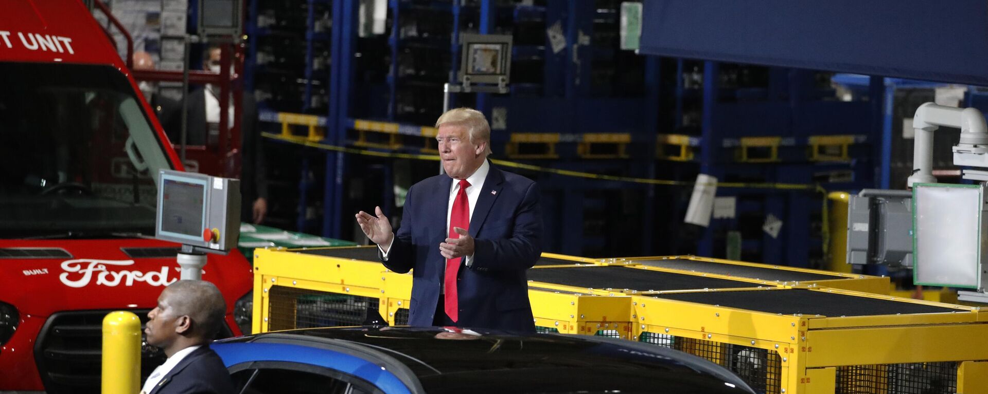 FILE - President Donald Trump claps as he walks to the podium to speak at Ford's Rawsonville Components Plant that has been converted to making personal protection and medical equipment, Thursday, May 21, 2020, in Ypsilanti, Mich. Former President Donald Trump will skip the second GOP presidential debate next week to travel to Detroit as the auto worker strike enters its second week. Trump is planning to speak with union members and will look to blunt criticisms from a United Auto Workers union leadership that has said a second Trump term would be a “disaster.” - Sputnik International, 1920, 22.09.2023