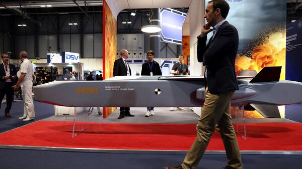 A visitor walks past a guide missile ground target KEPD 350 manufactured by the Swedish-German company Taurus at the International Defence and Security fair of Madrid, on May 17, 2023.  - Sputnik International