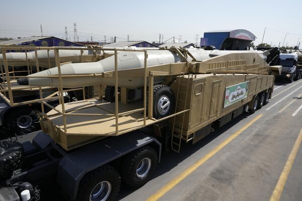 Sejjil missiles are carried on a truck during an annual military parade. Sejjil are solid-fueled medium-ranged ballistic missiles.  - Sputnik International