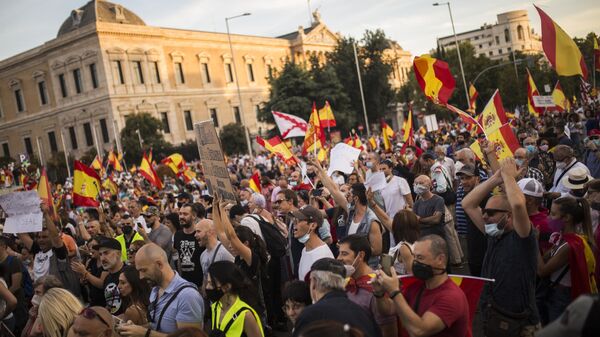 People take part in a protest to demand Spanish Prime Minister Pedro Sanchez's resignation in Madrid, Spain.  - Sputnik International