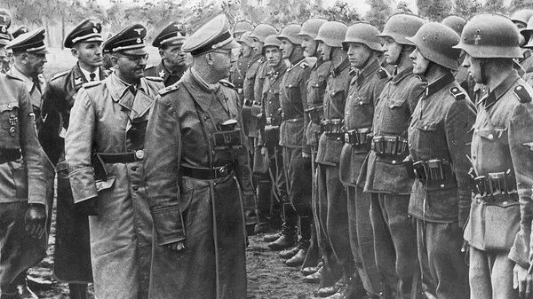 Reichsführer Heinrich Himmler (in the foreground) in the company of German officers in front of the unit of the 14th Grenadier Division of the Waffen SS Galizien. Otto von Wachter is visible among the officers. - Sputnik International
