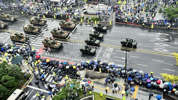 Military vehicles move during a military parade to mark the 75th anniversary of Soth Korea's armed forces, the biggest Armed Forces Day ceremony in a decade, in Seoul, South Korea. - Sputnik International