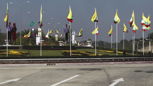 National flags line the a traffic circle ahead of Saturday's 75th Union Day, Friday, Feb. 11. 2022, in Naypyitaw, Myanmar.  - Sputnik International