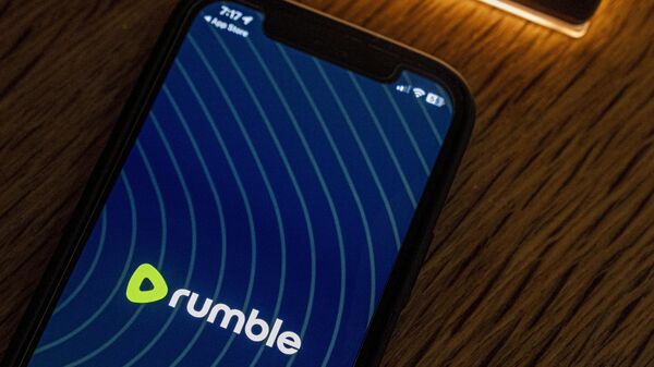 An iPhone displaying the logo for the Rumble app, Saturday, Sept. 23, 2023, in Washington. The exclusive online livestream for the second Republican presidential debate this week will take place on Rumble, an alternative video sharing platform that has been criticized for allowing far-right extremism, bigotry, election disinformation and conspiracy theories. - Sputnik International
