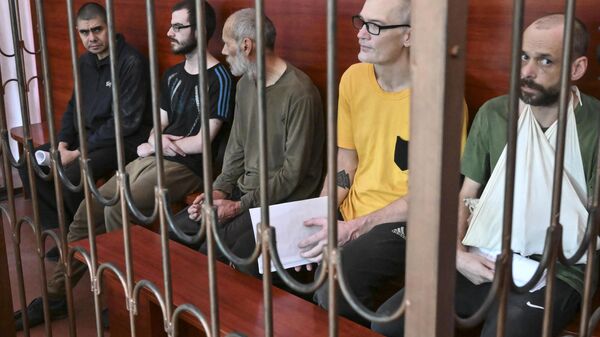 Foreign mercenaries are seen being brought to court in Donetsk. File photo - Sputnik International