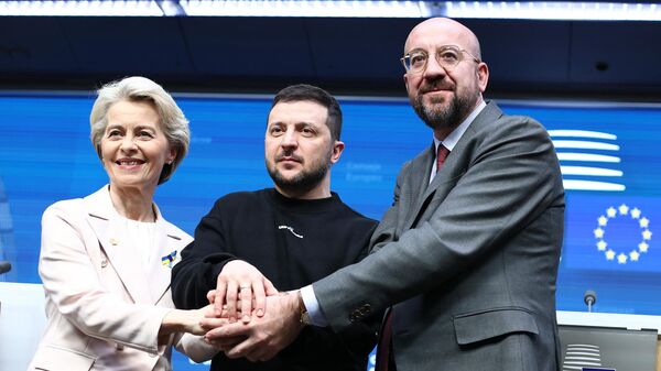 President of the European Council Charles Michel (R) European Commission President Ursula von der Leyen and Ukrainian president Volodymyr Zelensky shake hands following a press conference after a round-table meeting as part of a EU summit in Brussels, on February 9, 2023.  - Sputnik International