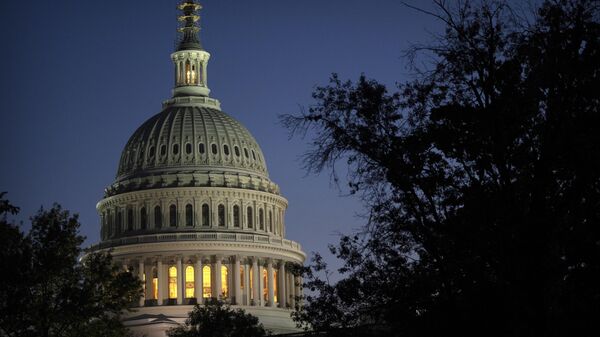 Night falls on the dome of the Capitol, hours after Rep. Kevin McCarthy, R-Calif., was ousted as Speaker of the House, Tuesday, Oct. 3, 2023 in Washington.  - Sputnik International