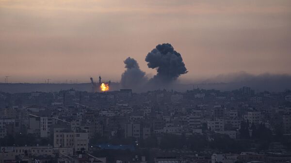Smoke rises after the Israeli air strike in the Gaza Strip - Sputnik International